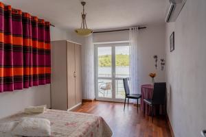 Postel nebo postele na pokoji v ubytování Guesthouse Kamarin