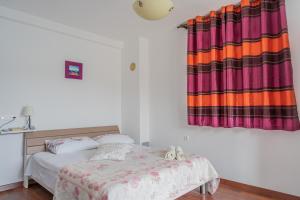 Postel nebo postele na pokoji v ubytování Guesthouse Kamarin