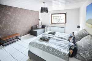 Ένα ή περισσότερα κρεβάτια σε δωμάτιο στο fewo-elzerhof