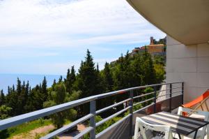 a balcony with a view of the ocean at La Perle d'Eze - Aparthotel in Éze