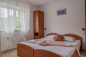 Postel nebo postele na pokoji v ubytování Guesthouse Kamarin