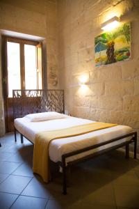 Postel nebo postele na pokoji v ubytování B&B Malennio