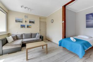Posteľ alebo postele v izbe v ubytovaní Sopot Baltic Sands Apartment by Grand Apartments
