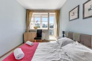 Posteľ alebo postele v izbe v ubytovaní Sopot Baltic Sands Apartment by Grand Apartments
