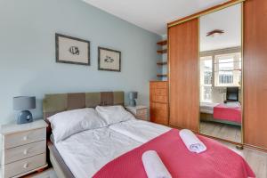 Posteľ alebo postele v izbe v ubytovaní Sopot Baltic Sands Apartment by Grand Apartments