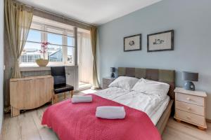 Posteľ alebo postele v izbe v ubytovaní Sopot Baltic Sands Apartment by Grand Apartments