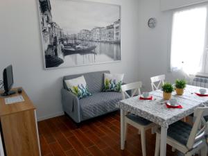 a living room with a couch and a table at VCE House in Tessera