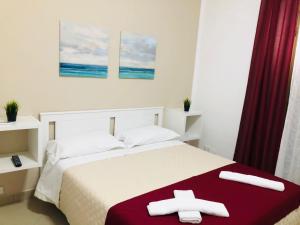 Giường trong phòng chung tại La casa di Palma