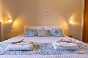 Postel nebo postele na pokoji v ubytování Villa Curiazzi Guesthouse Viale la Pelosa 16