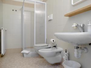 a bathroom with a sink and a toilet and a shower at Guest House Villa Angaran San Giuseppe in Bassano del Grappa