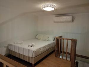 Postel nebo postele na pokoji v ubytování Villa Ageri