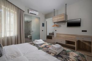 Postel nebo postele na pokoji v ubytování Mare Blue Suites