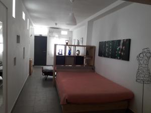 Ένα ή περισσότερα κρεβάτια σε δωμάτιο στο Sadinahome