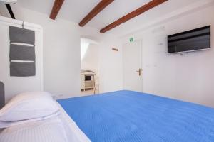 Postel nebo postele na pokoji v ubytování Studio Apartment Bell