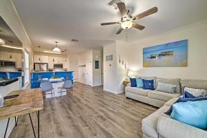 a living room with a couch and a table at Modern Island Condo with Pool Steps to the Beach! in South Padre Island