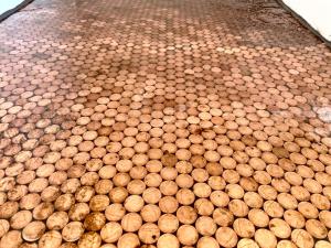 a tiled floor with a bunch of balls on it at Lilac Tree Hut in Tenby