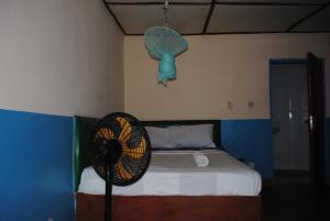 A bed or beds in a room at Rainbow beach resort