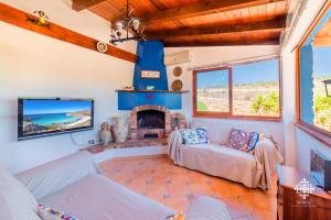 Μια τηλεόραση ή/και κέντρο ψυχαγωγίας στο Residenza Ormos - Dimore sul mare