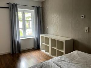 Säng eller sängar i ett rum på FEWO im Kneipenviertel Altkötzschenbroda