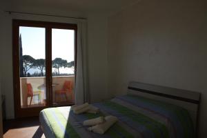 A bed or beds in a room at Agriturismo Nonna Bettina