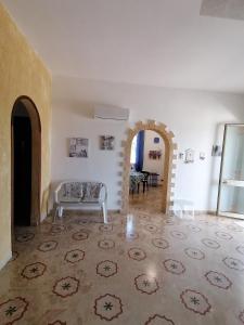 a living room with a couch and a table at Villa Giulia in Alcamo Marina