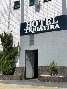 a hotel hollywood sign on the side of a building at Hotel Tiquatira - Zona Leste in Sao Paulo