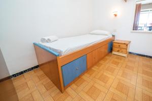 Posteľ alebo postele v izbe v ubytovaní HomeHolidaysRentals Miramar - Costa Barcelona