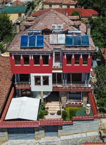 an aerial view of a house with solar panels on its roof at Vila 3 Korçë in Korçë