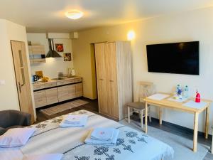 Posteľ alebo postele v izbe v ubytovaní Apartamenty u Magika