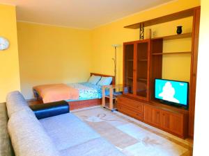 A bed or beds in a room at Apartment Набережная Иртыша им.Славского