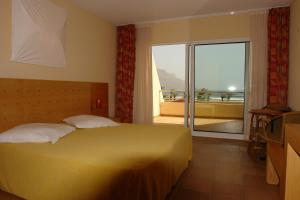 Кровать или кровати в номере Flag Hotel Foya Branca