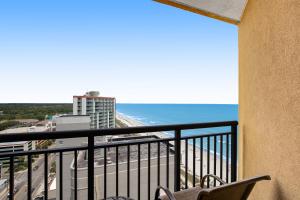 a balcony with a view of the beach and the ocean at Anderson Ocean Club and Spa by Oceana Resorts in Myrtle Beach