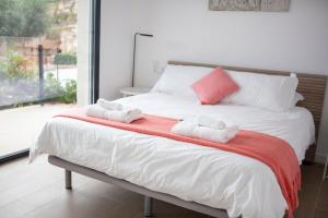 Posteľ alebo postele v izbe v ubytovaní Casa KARIAN
