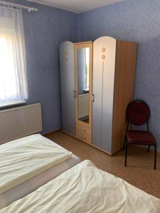 Postel nebo postele na pokoji v ubytování Ferienhäuser Wede