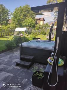 an image of a hot tub in a yard at Apartmán Martin in Martin
