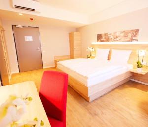 Posteľ alebo postele v izbe v ubytovaní KELKO 1A Hotel