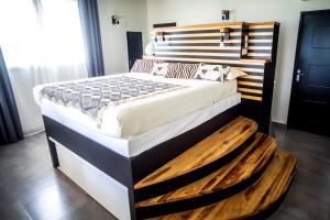Postel nebo postele na pokoji v ubytování La Suite Villa