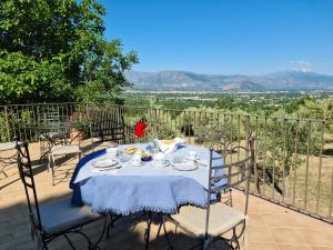 a table and chairs on a balcony with a view at Rocca Lorenizo in Pacentro