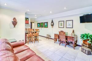a living room with a couch and a table at Torres Colina in Escazu