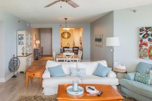 a living room with a couch and a table at Beach Colony of Perdido West in Perdido Key