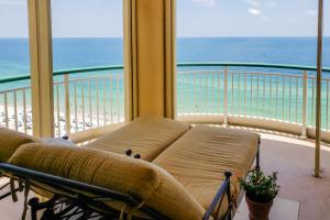 a living room with a couch and a view of the ocean at Beach Colony of Perdido West in Perdido Key