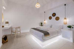 Posteľ alebo postele v izbe v ubytovaní Quattro Venti Suites Mykonos