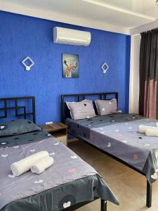 Postel nebo postele na pokoji v ubytování Aparthotel Alfa