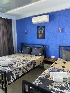 Postel nebo postele na pokoji v ubytování Aparthotel Alfa