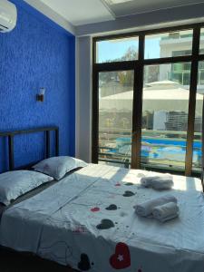 Postel nebo postele na pokoji v ubytování Aparthotel Alfa