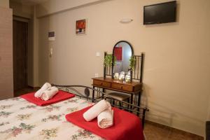 Postel nebo postele na pokoji v ubytování Villa Rafailia