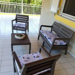 two chairs and a table on a patio at Fully Equipped Beach House at Pachia Ammos Plytra in Plitra