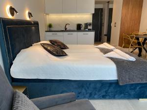 Un ou plusieurs lits dans un hébergement de l'établissement ApartPark Apartament Albus