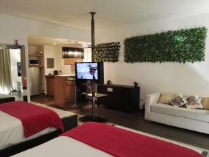 a living room with a couch and a tv in it at Playa Blanca in Playa Blanca