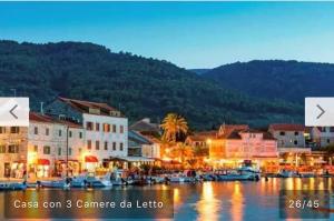 a town with a harbor with boats in the water at Stella Marina in Stari Grad